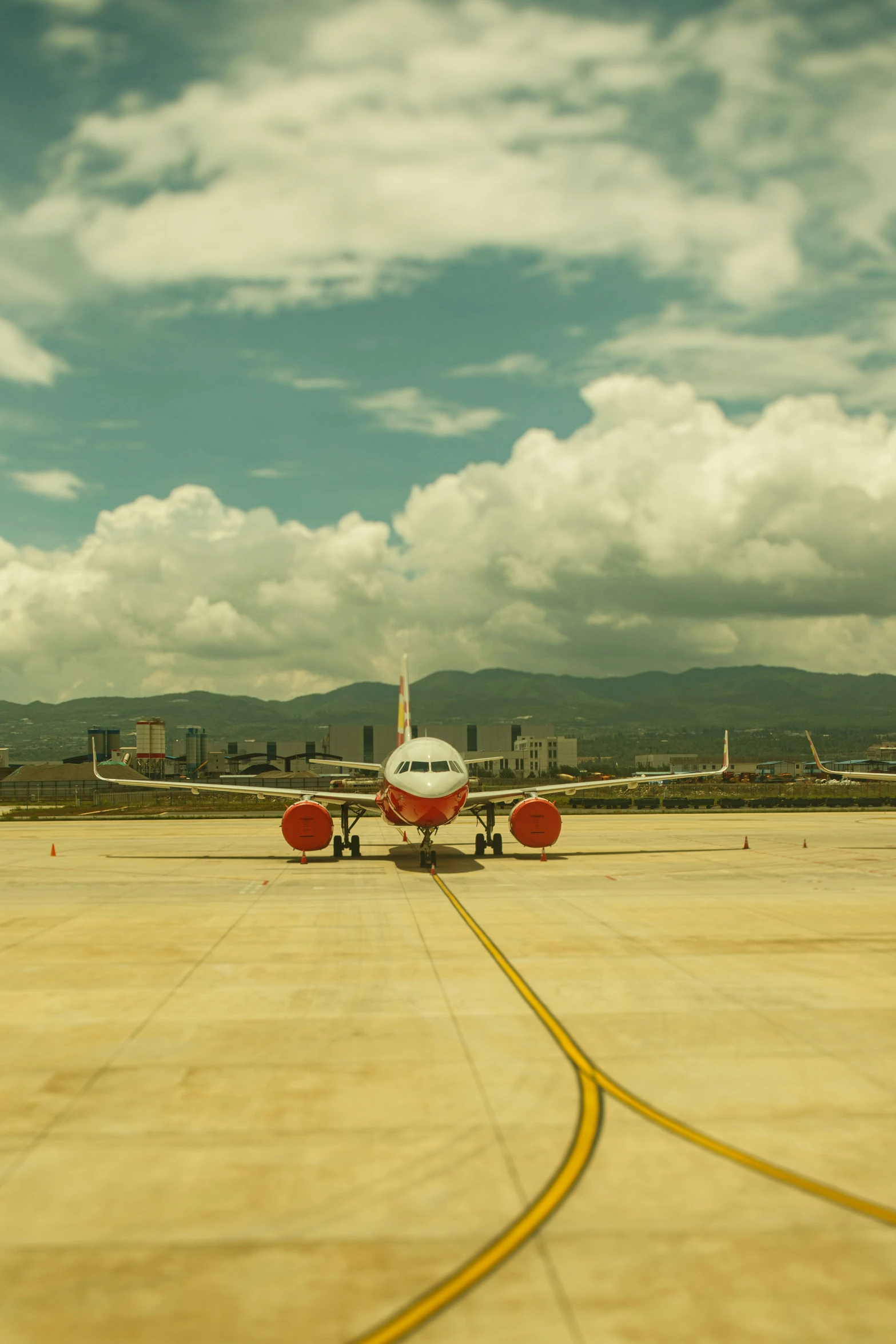 an airplane in the runway taking off from the airport