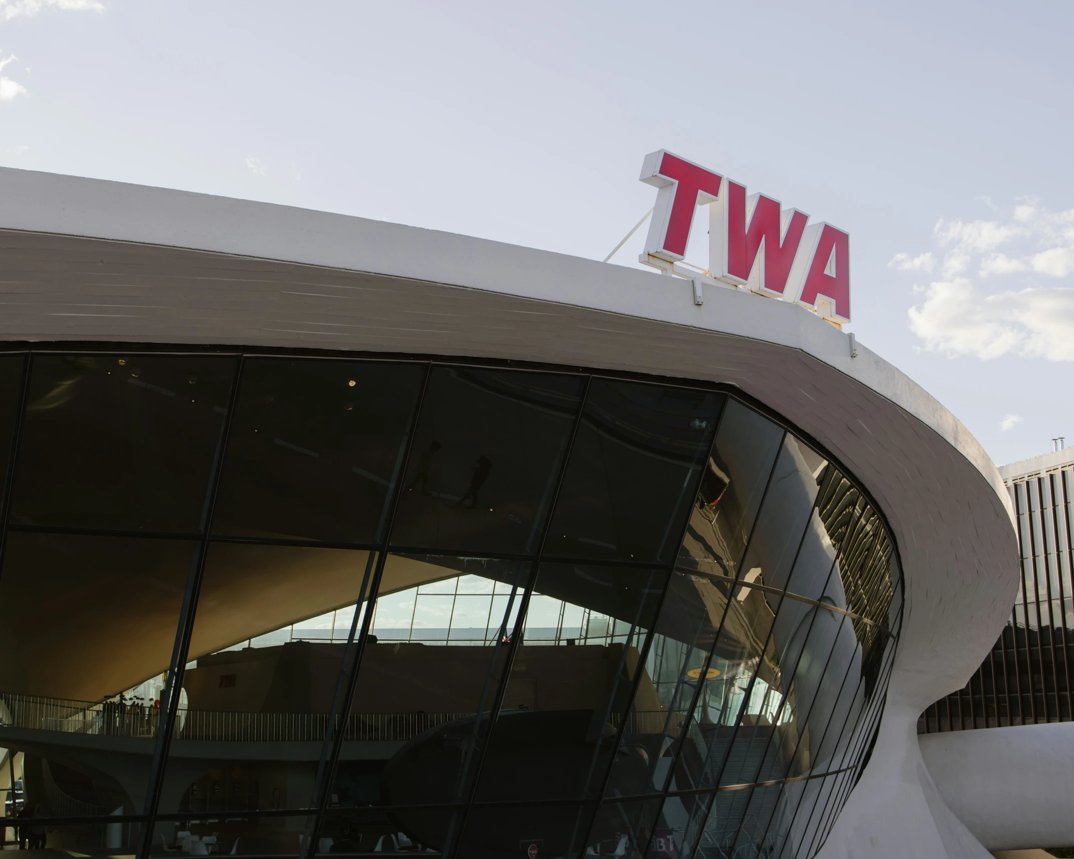 a very large building with a red awt on top