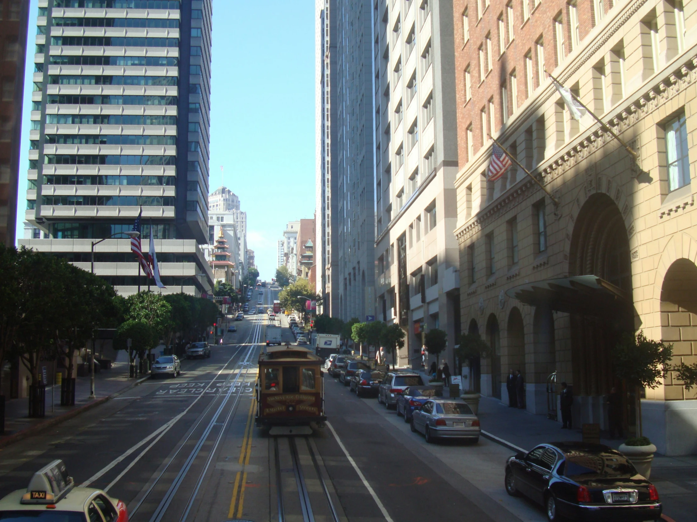 the trolley system is going down the street