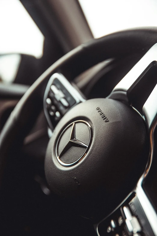 the steering wheel of a mercedes vehicle is shown