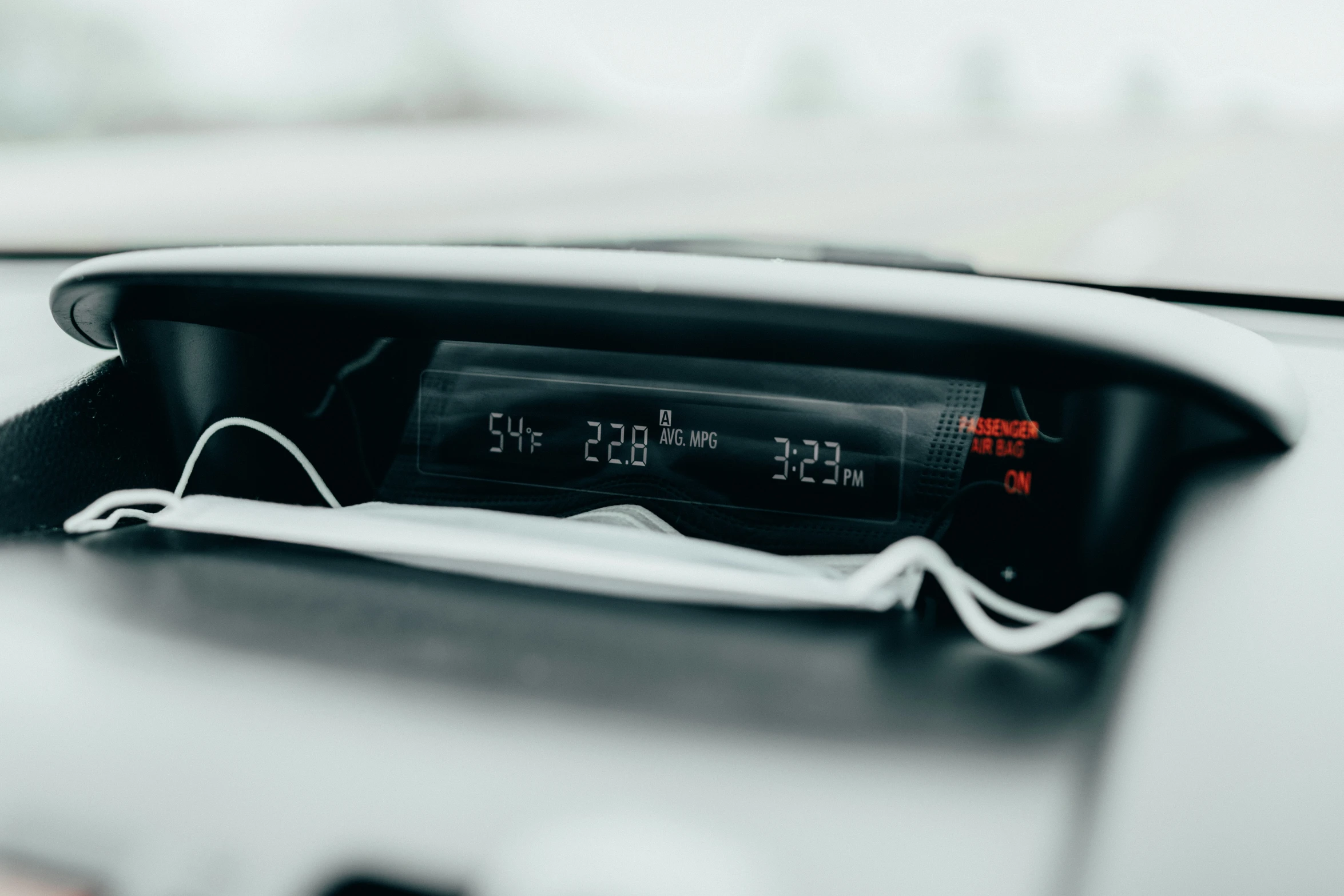 a car dashboard with an alarm clock in it