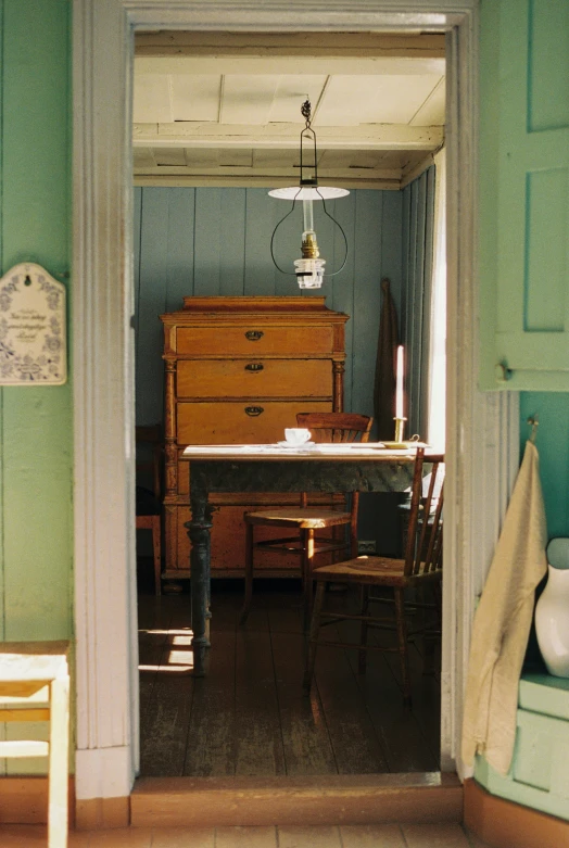 a chair a table and other furniture in a room