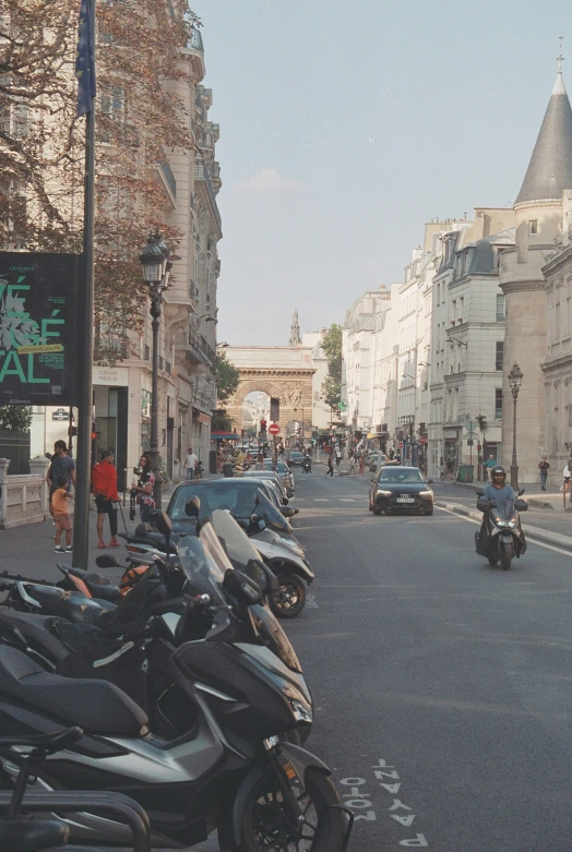 motorcycles parked in the middle of an empty street