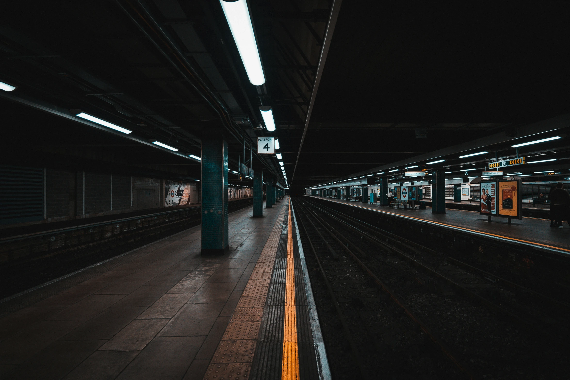 empty subway station with one car at night