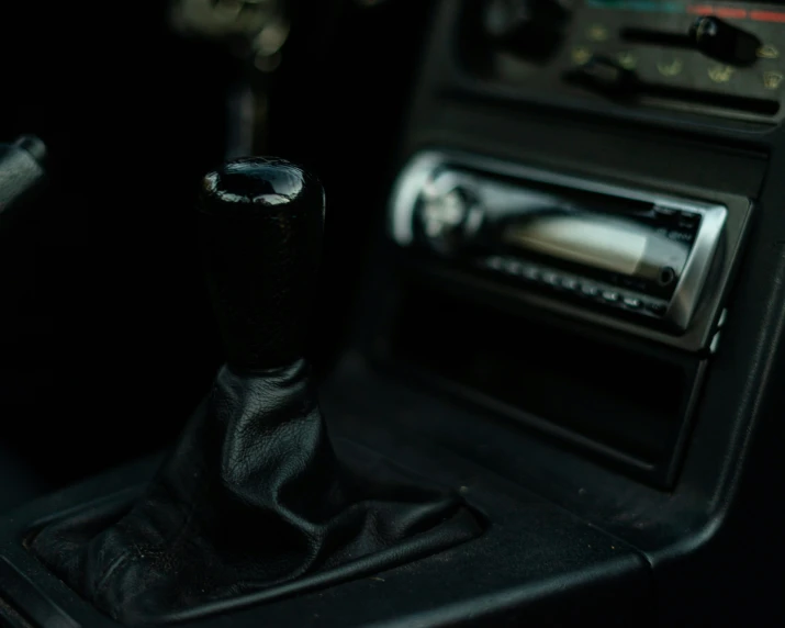 the interior of an old car, with the dashboard and radio showing