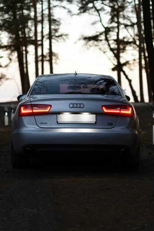 a car that is parked near some trees