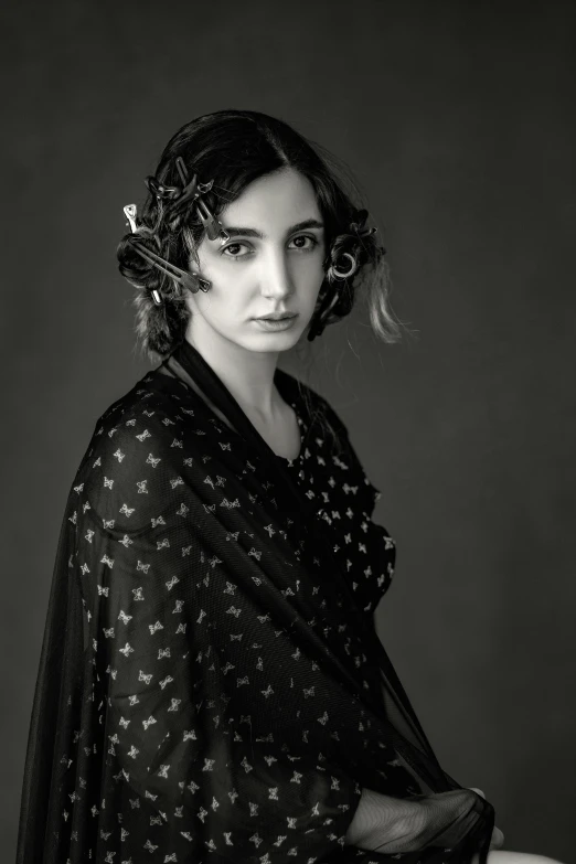 woman in black and white pograph with a hair comb