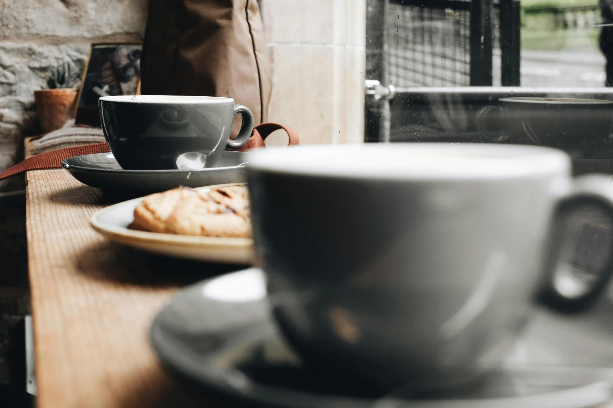 there is a plate and coffee cup on the table