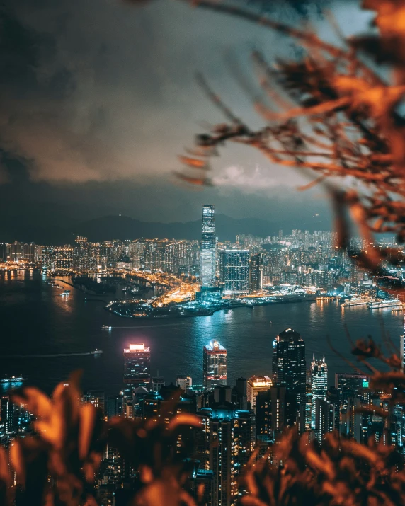 a city night scene and a view from the top of an hill