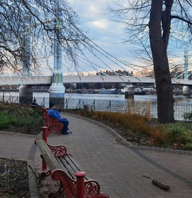 there are two park benches on the path