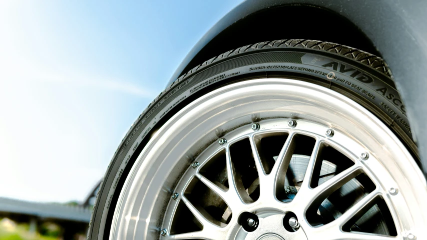 a wheel is shown against a blue sky