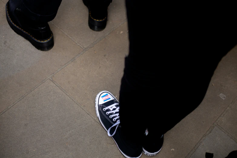 an image of people feet in sneakers