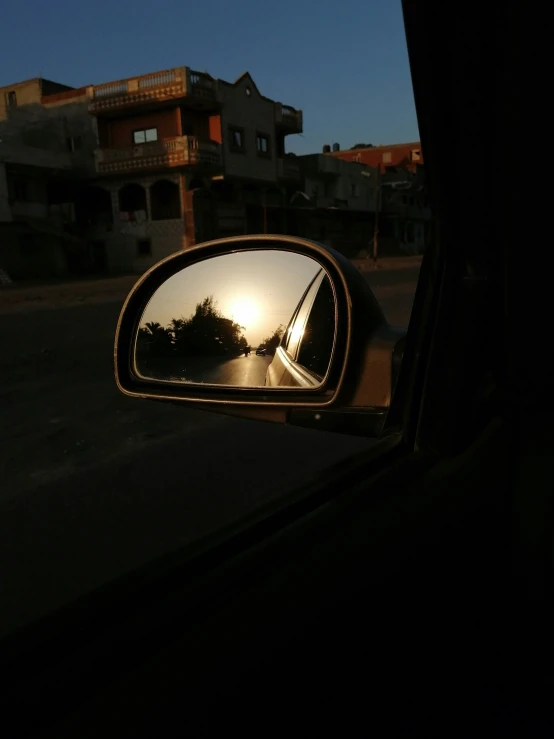 a side view mirror on the front of a car