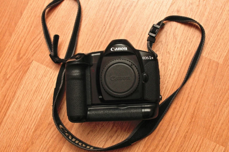 a camera sitting on top of a wooden floor