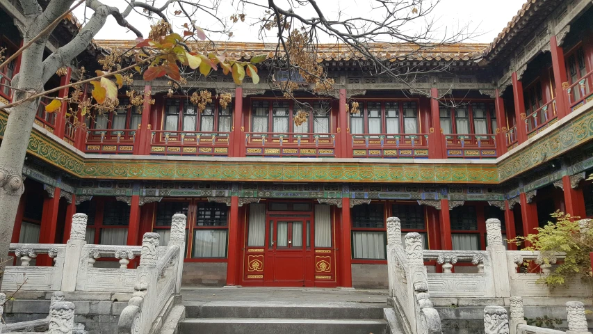 a chinese building has stairs leading to it