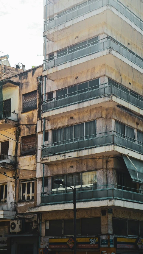 an image of buildings with balconies in the windows