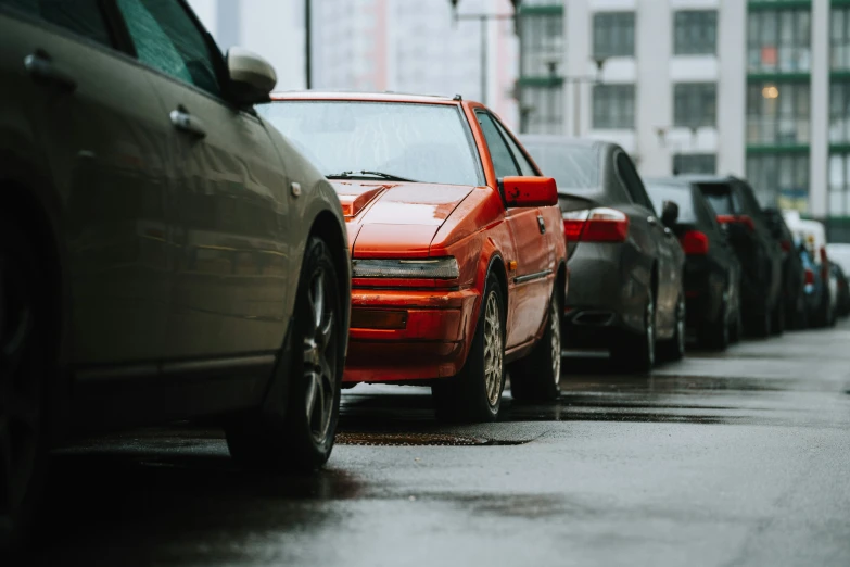 the cars are all parked in a row