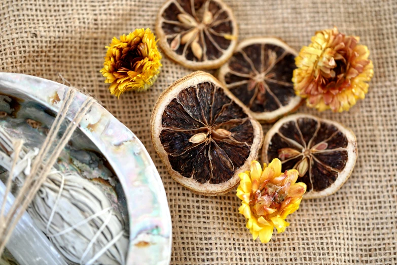 dried fruit sits on a brown burlack tablecloth