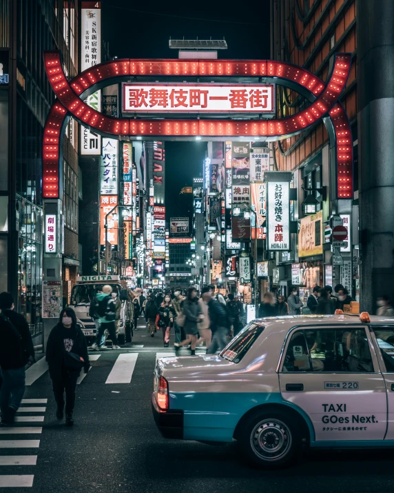 a taxi cab is stopped outside of an asian business