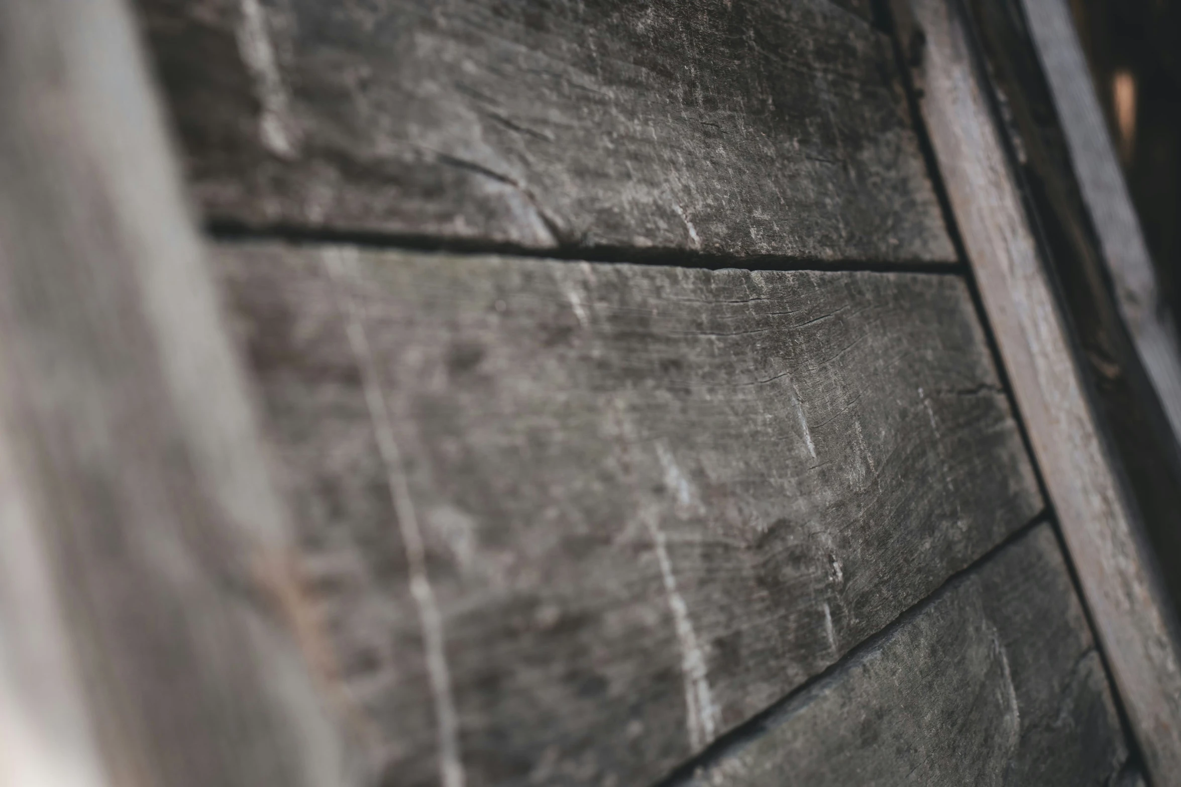 a close up of the side wall of a wooden building