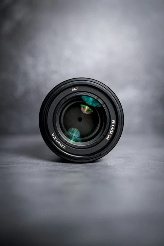 the pographer's lens on a gray background