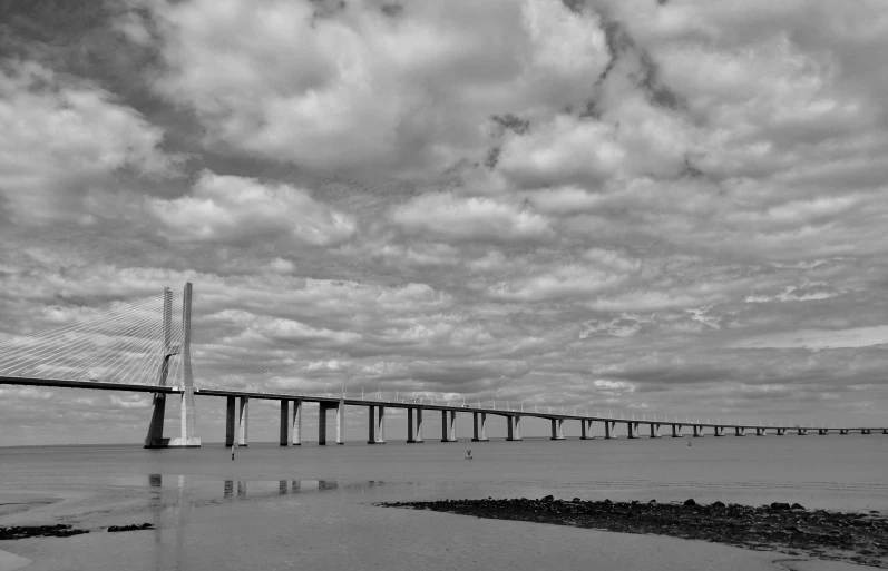 a large bridge spanning across the ocean