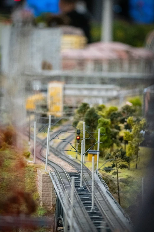 a train yard with a train going under the bridge