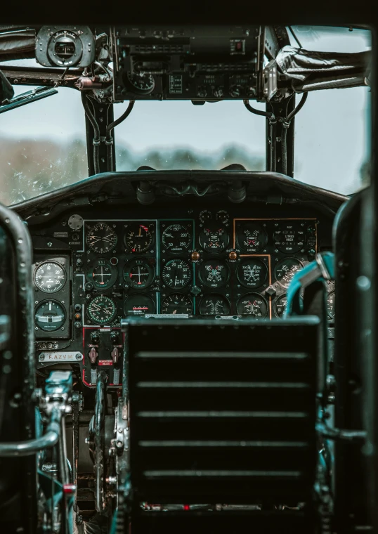 the cockpit of an old plane with several switches and s