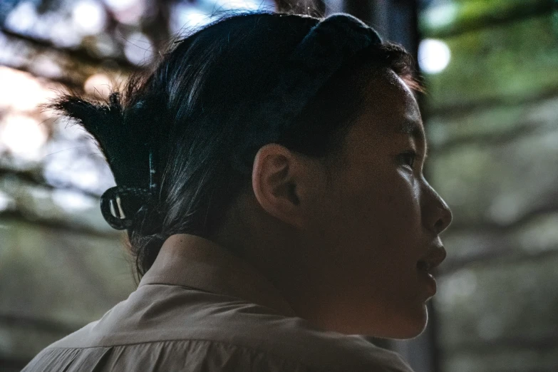 a profile s of a young woman with dark hair