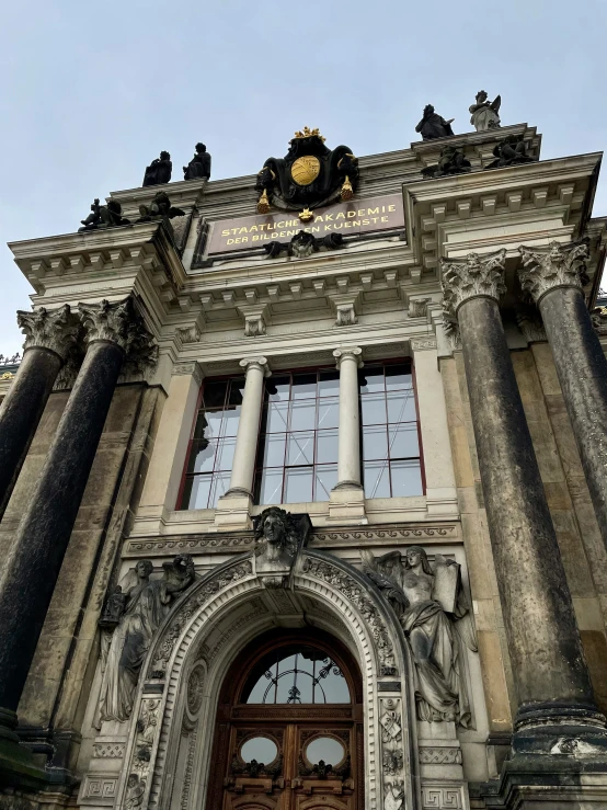 an old building with columns and a clock