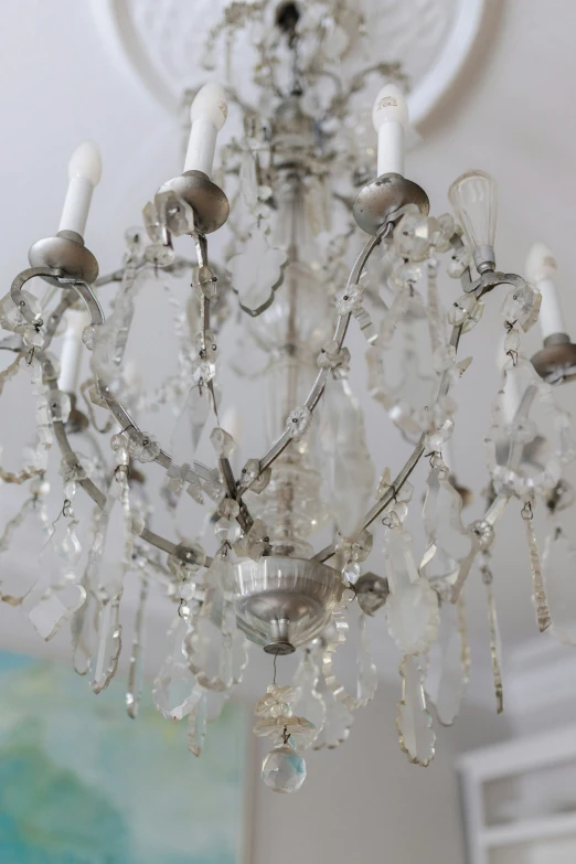 a white chandelier hanging from a ceiling