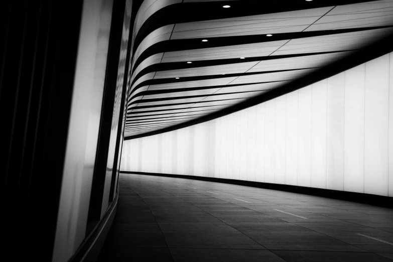 black and white po of a tunnel with lights