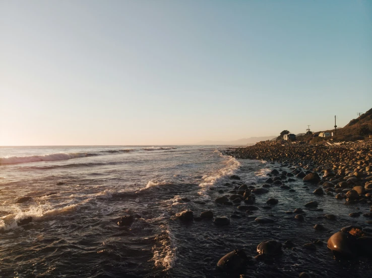 a large group of rocks near a body of water