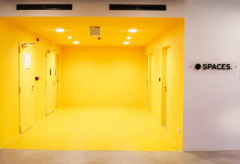 the walls are painted bright yellow to reflect light