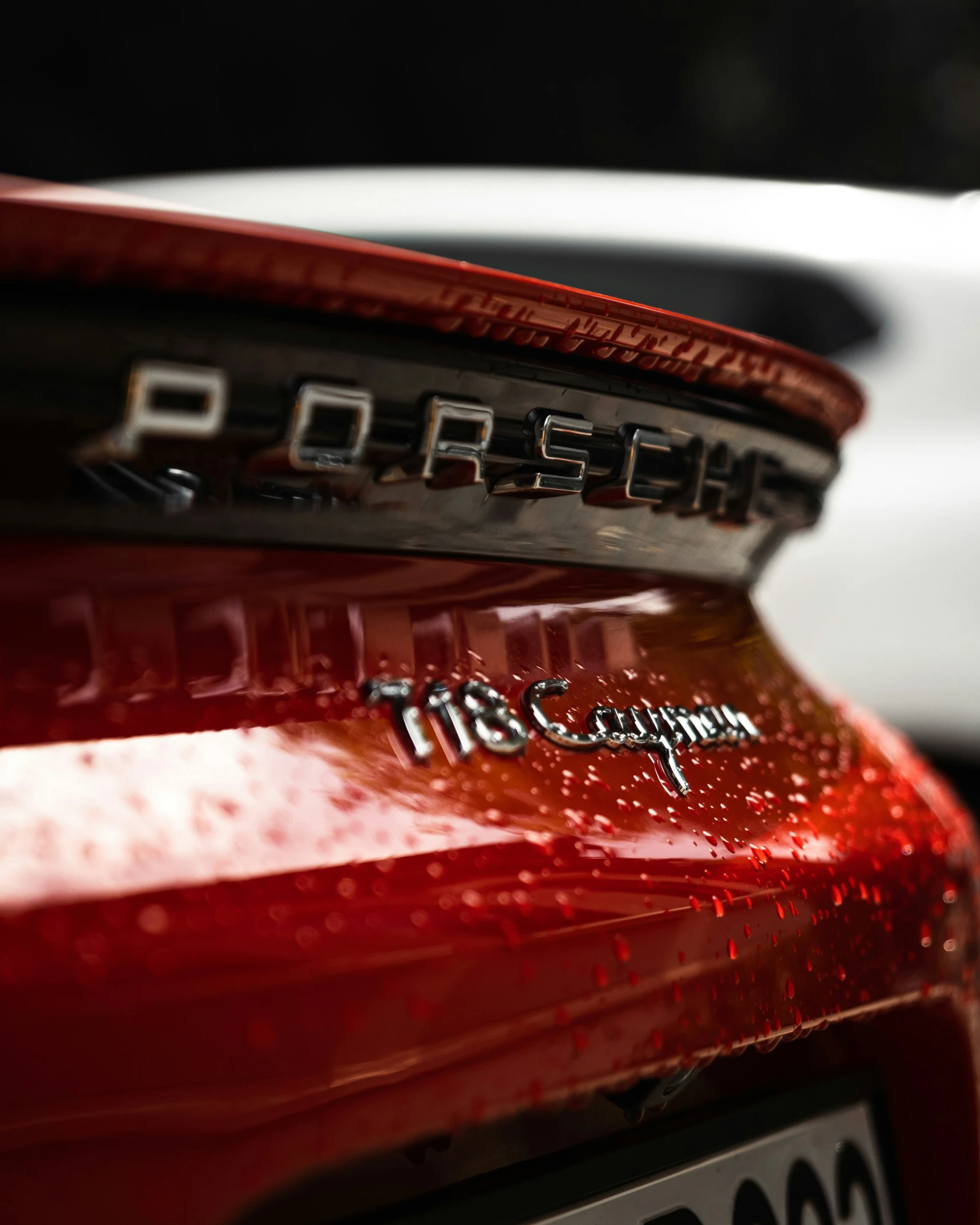 two cars with their logos on the hood