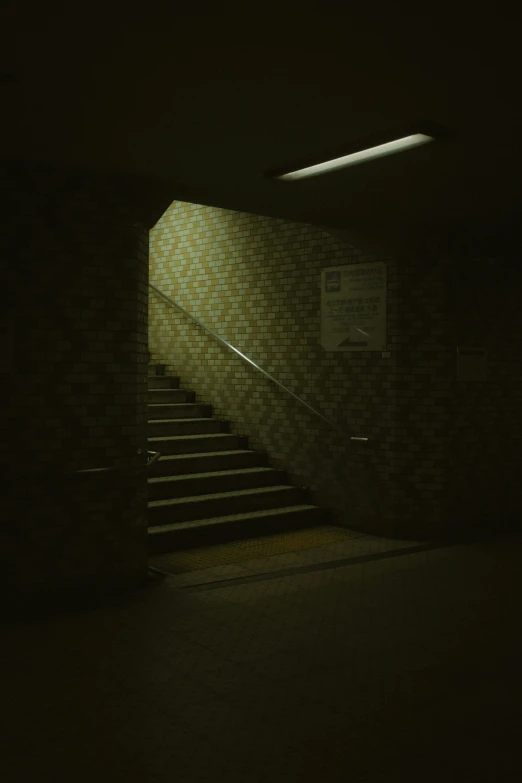 an image of a dimly lit stairway in a building