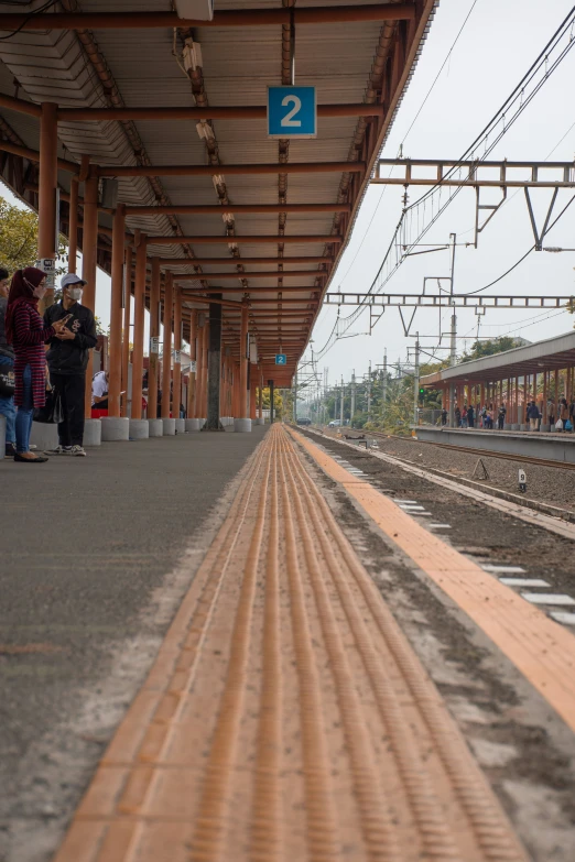 the train station has two blue signs next to it