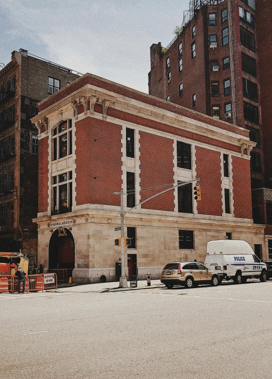 an old fire station on an urban street