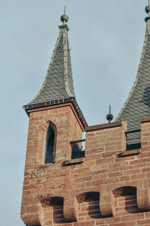 a view of two bell towers on the top of a building