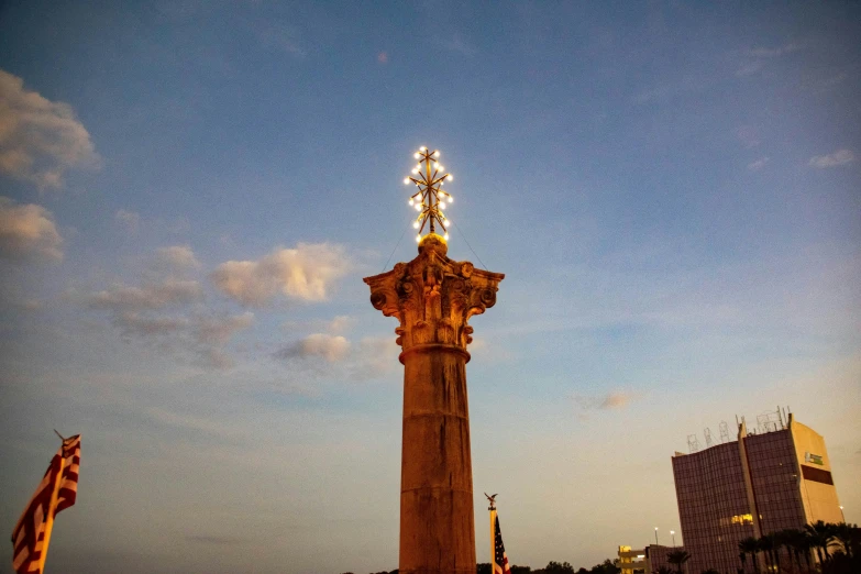 a tall clock tower next to another tall building