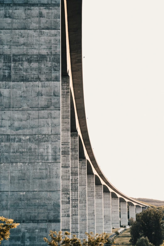 large gray and grey concrete building with the top section up