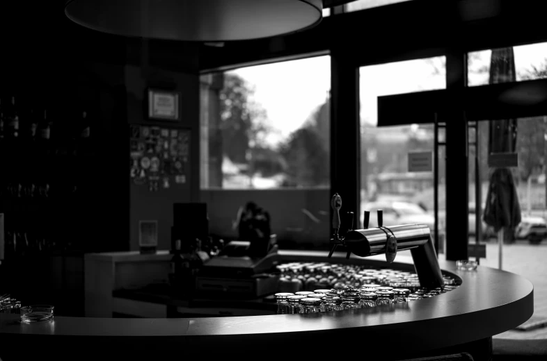 the counter is empty in this small black and white restaurant