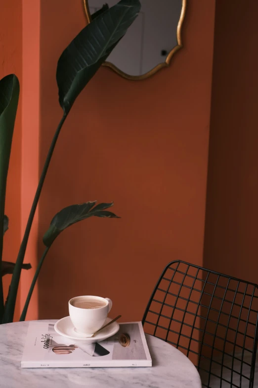 the plate has been placed on top of a cup, saucer and spoon