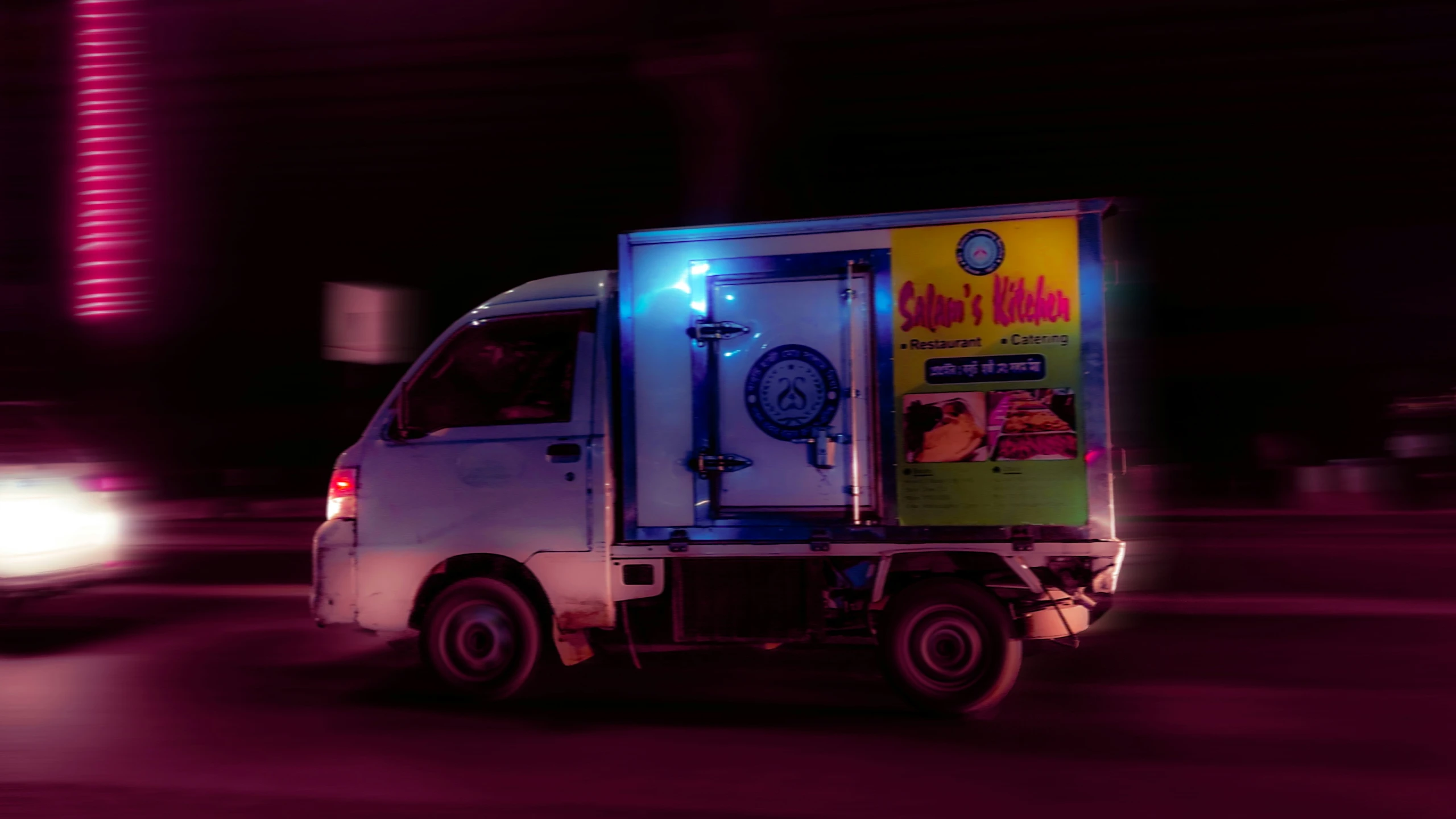 a white box truck driving down the road