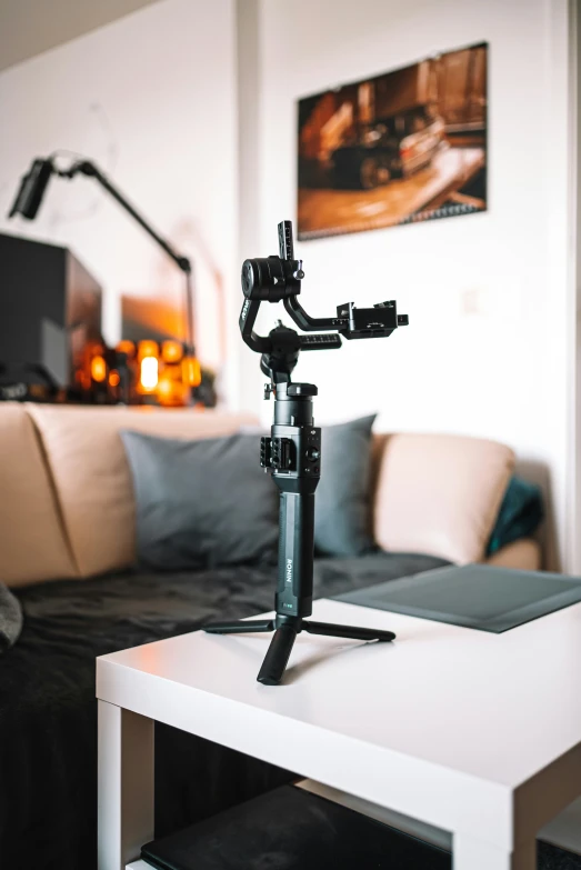 a camera tripod on a coffee table in a living room