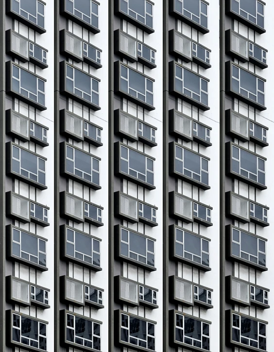 the view of a tall building with vertical windows and an arrow