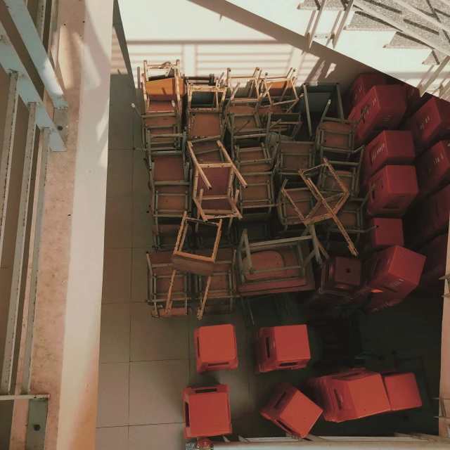 a bunch of chairs and table stacked on top of each other