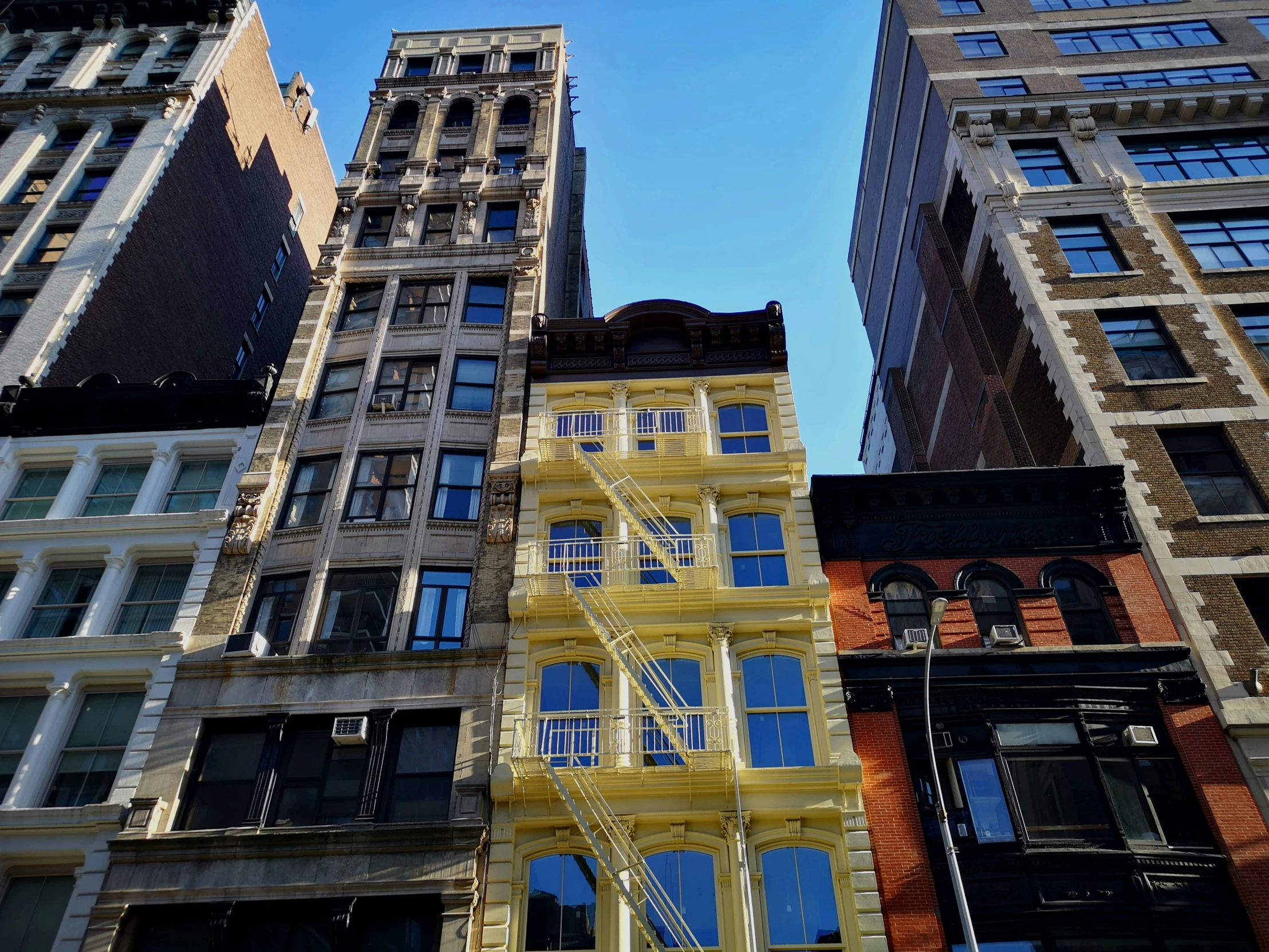 several buildings are all in different colors