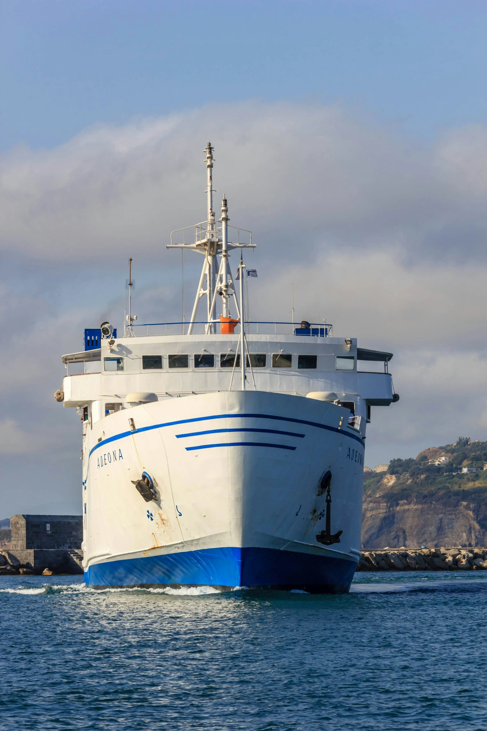 the large boat is anchored by the shore