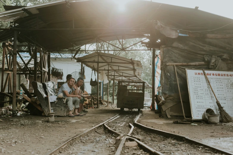 people in white shirts at an abandoned train station